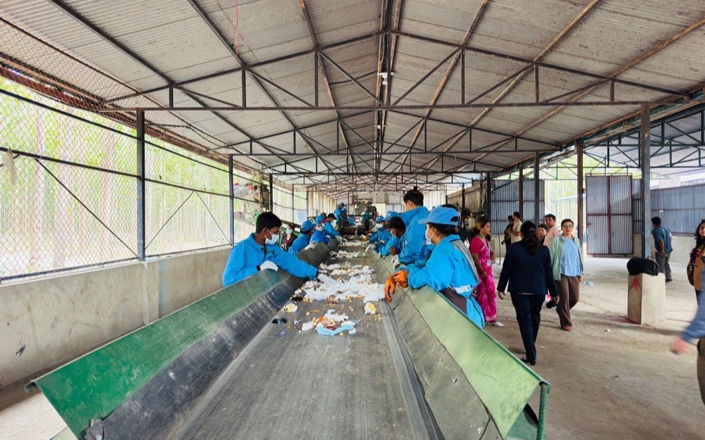 A picking line at a materials recovery facility